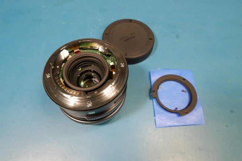 Rear lens disassembly screw location.